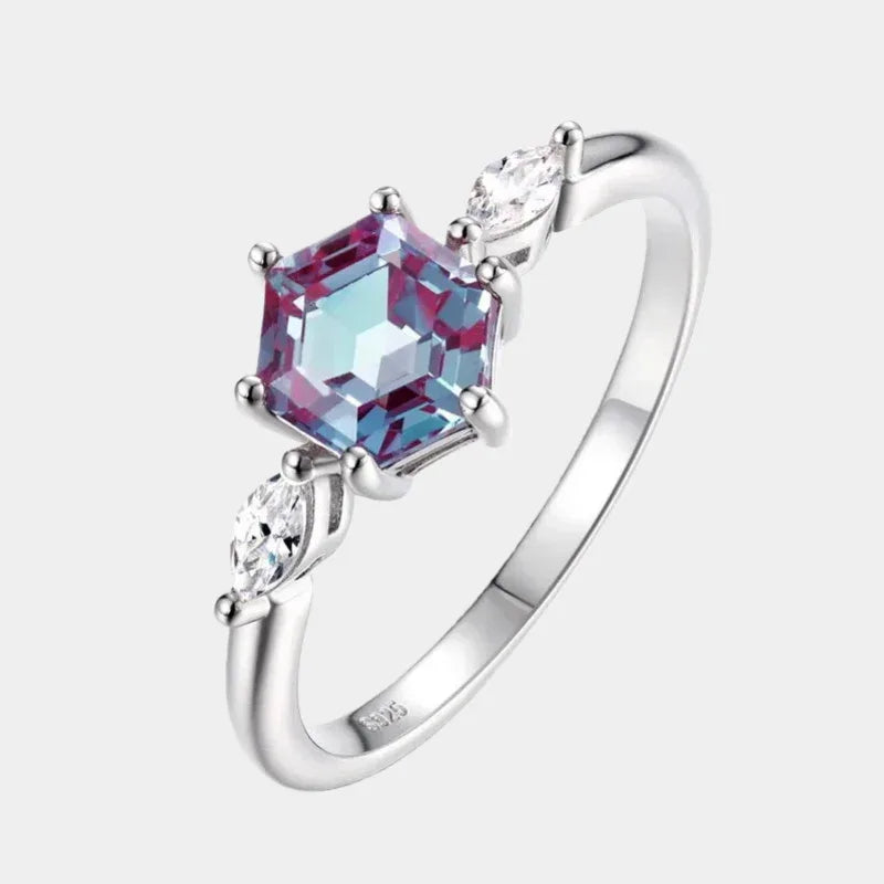 Hexagon Alexandrite ring with marquise-shaped clear accents, front product view on a white background