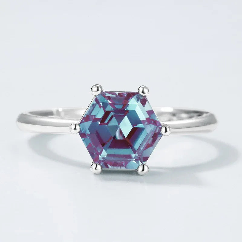 Hexagon Alexandrite solitaire ring, center stone close-up on a white background
