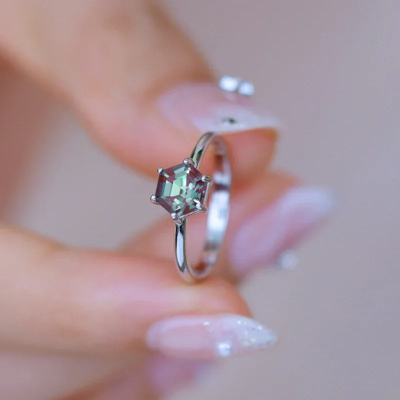 Hexagon Alexandrite solitaire ring, shown worn in a close lifestyle view