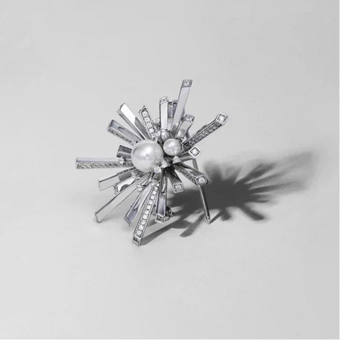Pearl Starburst Snowflake Brooch — angled product view casting a side shadow