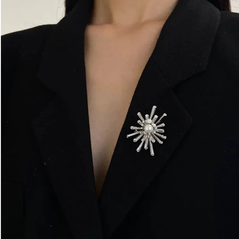 Pearl Starburst Snowflake Brooch — close worn view on a black lapel