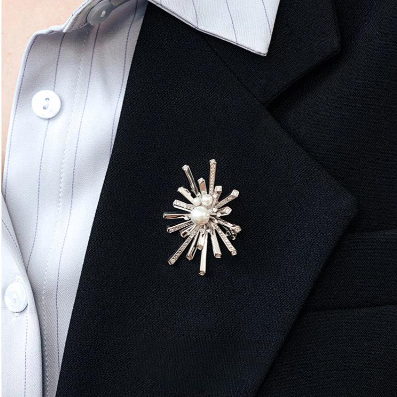 Pearl Starburst Snowflake Brooch — close blazer-worn view showing the brooch at the lapel