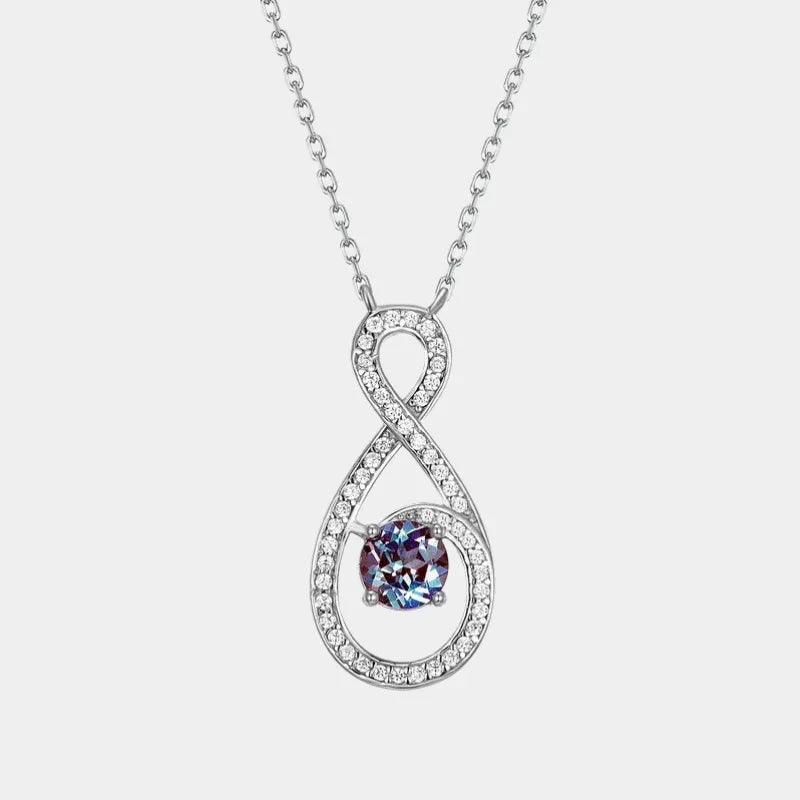 Infinity teardrop necklace with a round Alexandrite, full product view on a white background