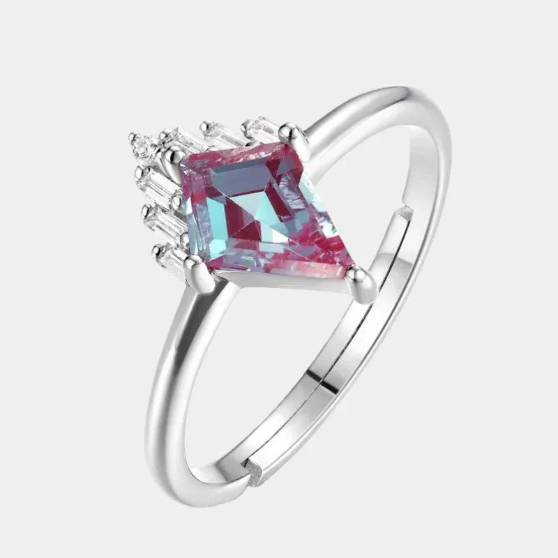 Kite-cut Alexandrite ring with a clear drop accent, front product view on a white background