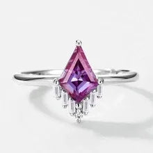 Kite-cut Alexandrite ring with a clear drop accent, pink-toned Alexandrite view under alternate lighting