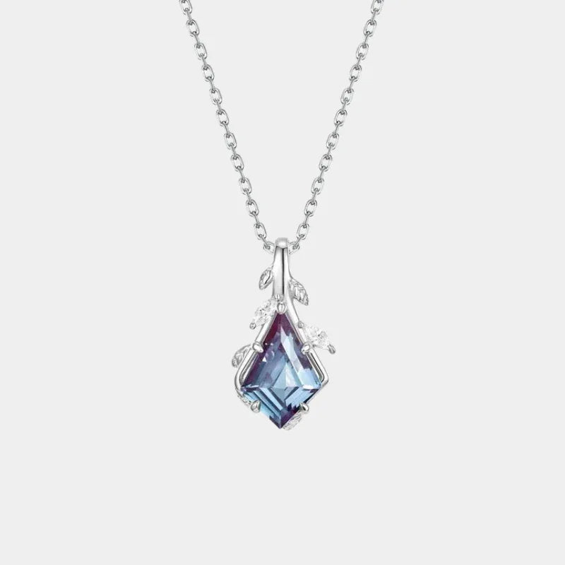 Kite-cut Alexandrite drop necklace with an open silver-tone frame, full product view on a white background
