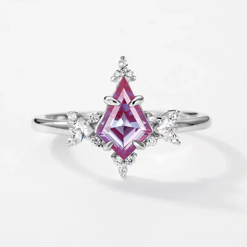 Kite-cut Alexandrite ring with clear halo accents, pink-toned Alexandrite view under alternate lighting