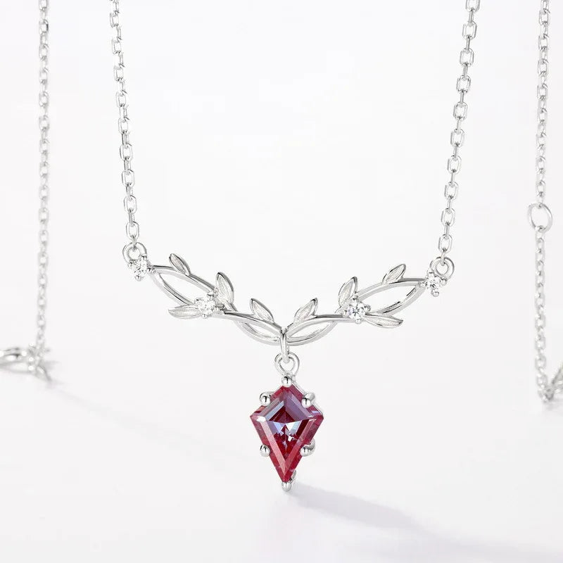 Kite-cut Alexandrite leaf collar necklace, pink-toned Alexandrite view under alternate lighting