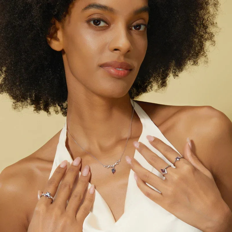 Kite-cut Alexandrite leaf collar necklace, shown worn by a model for scale