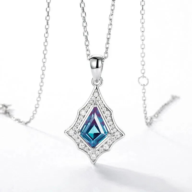 Kite-cut Alexandrite openwork pendant necklace, center stone close-up on a white background
