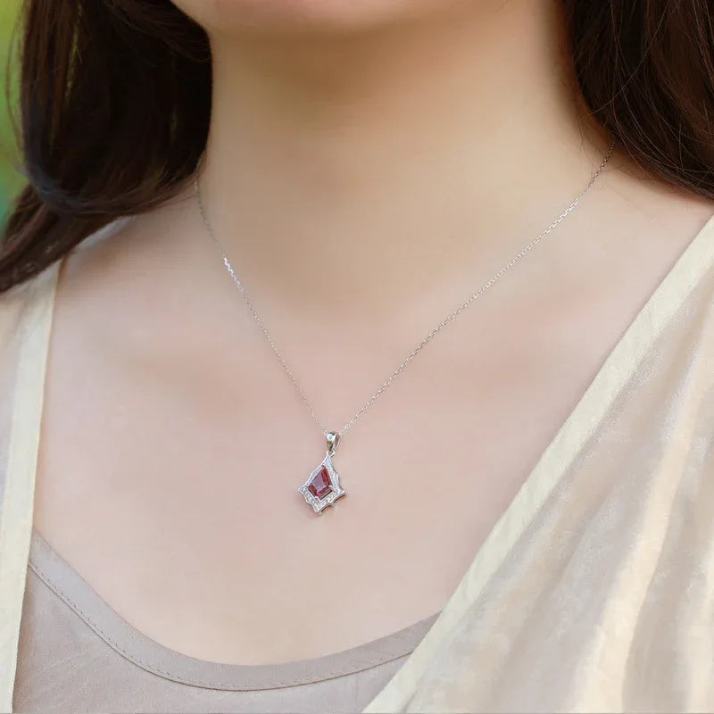Kite-cut Alexandrite openwork pendant necklace, shown worn in a close lifestyle view