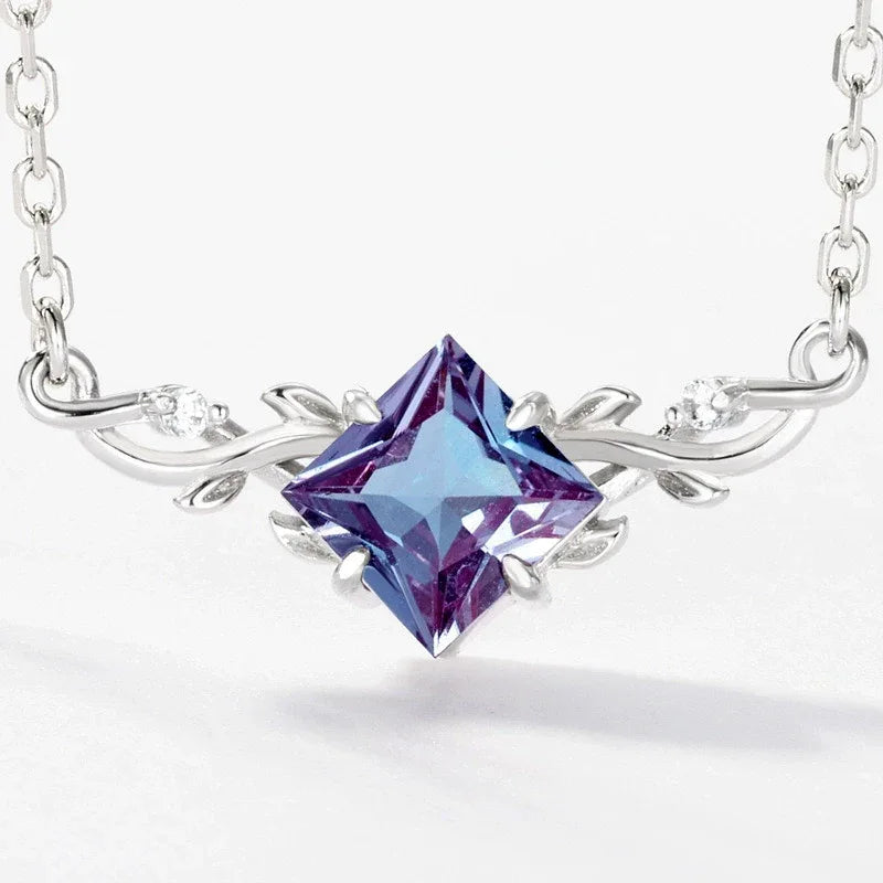 Kite-cut Alexandrite vine collar necklace, close-up showing the setting and decorative accents