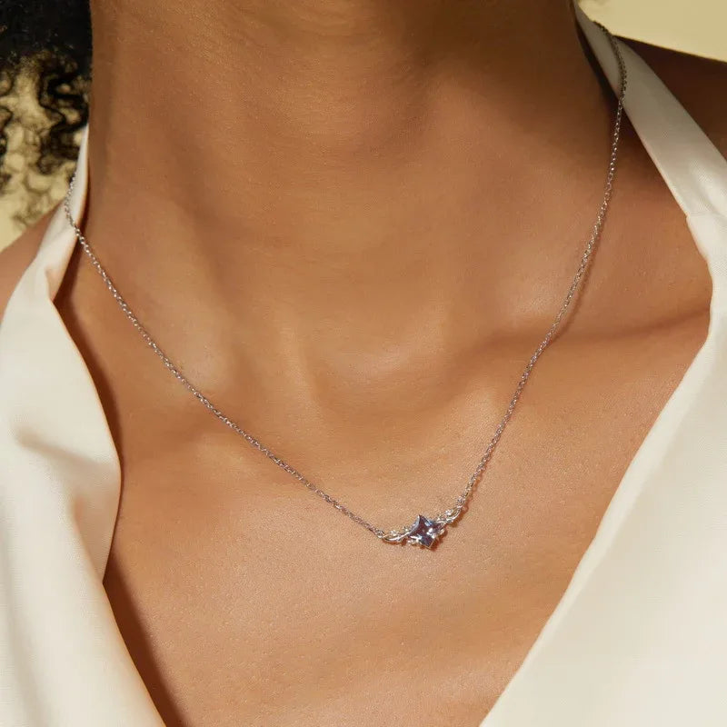 Kite-cut Alexandrite vine collar necklace, shown worn in a close lifestyle view
