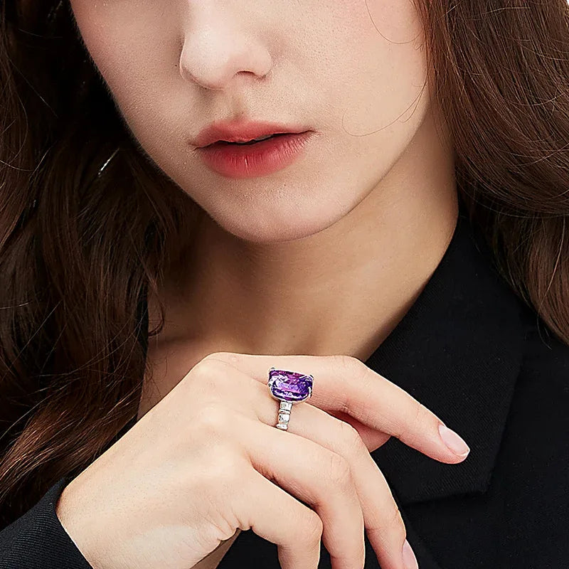rectangular amethyst solitaire ring styled portrait showing the ring for scale