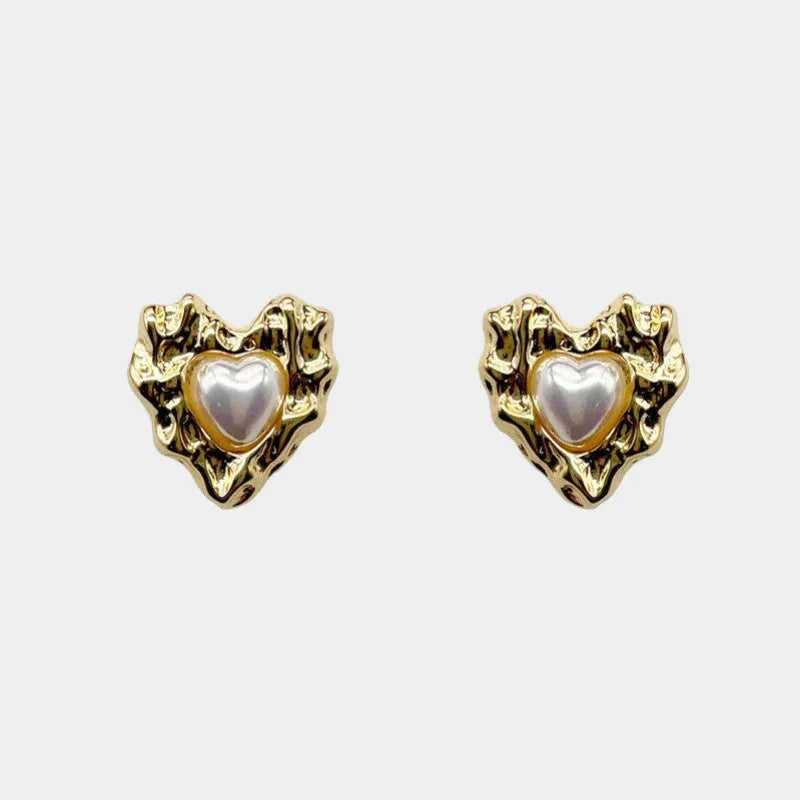Molten-Texture Heart Pearl Stud Earrings — front pair of heart studs with irregular gold-tone frames and pearl