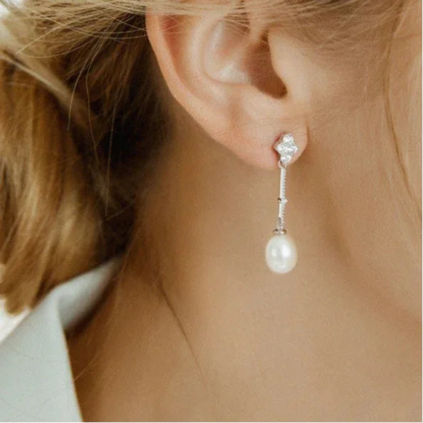 Teardrop Pearl Linear Earrings in Platinum-Plated S925 Silver — close left-ear worn view showing the chain and pearl