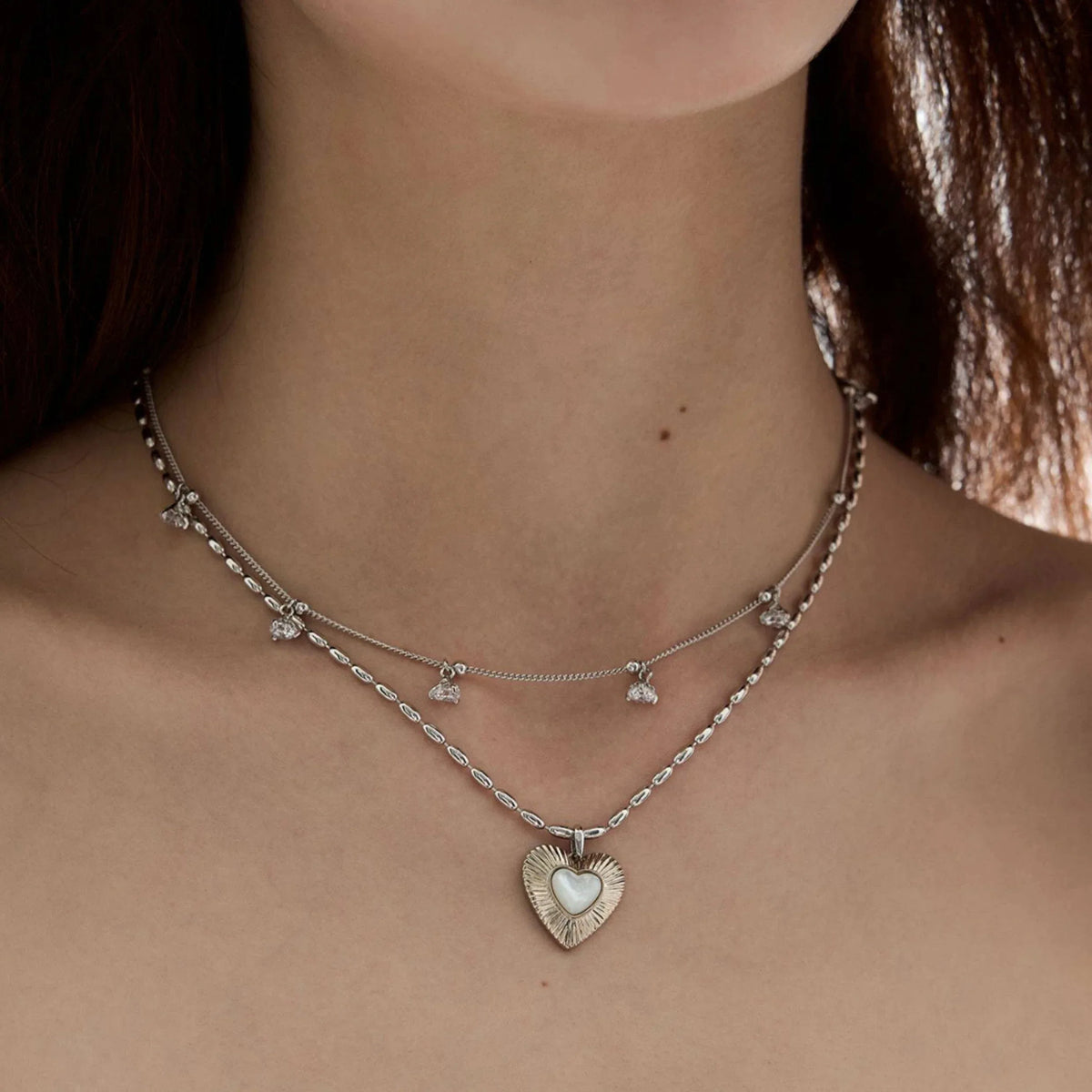 Double-Layer Pearl Heart Necklace — front neckline-worn portrait showing both chain layers