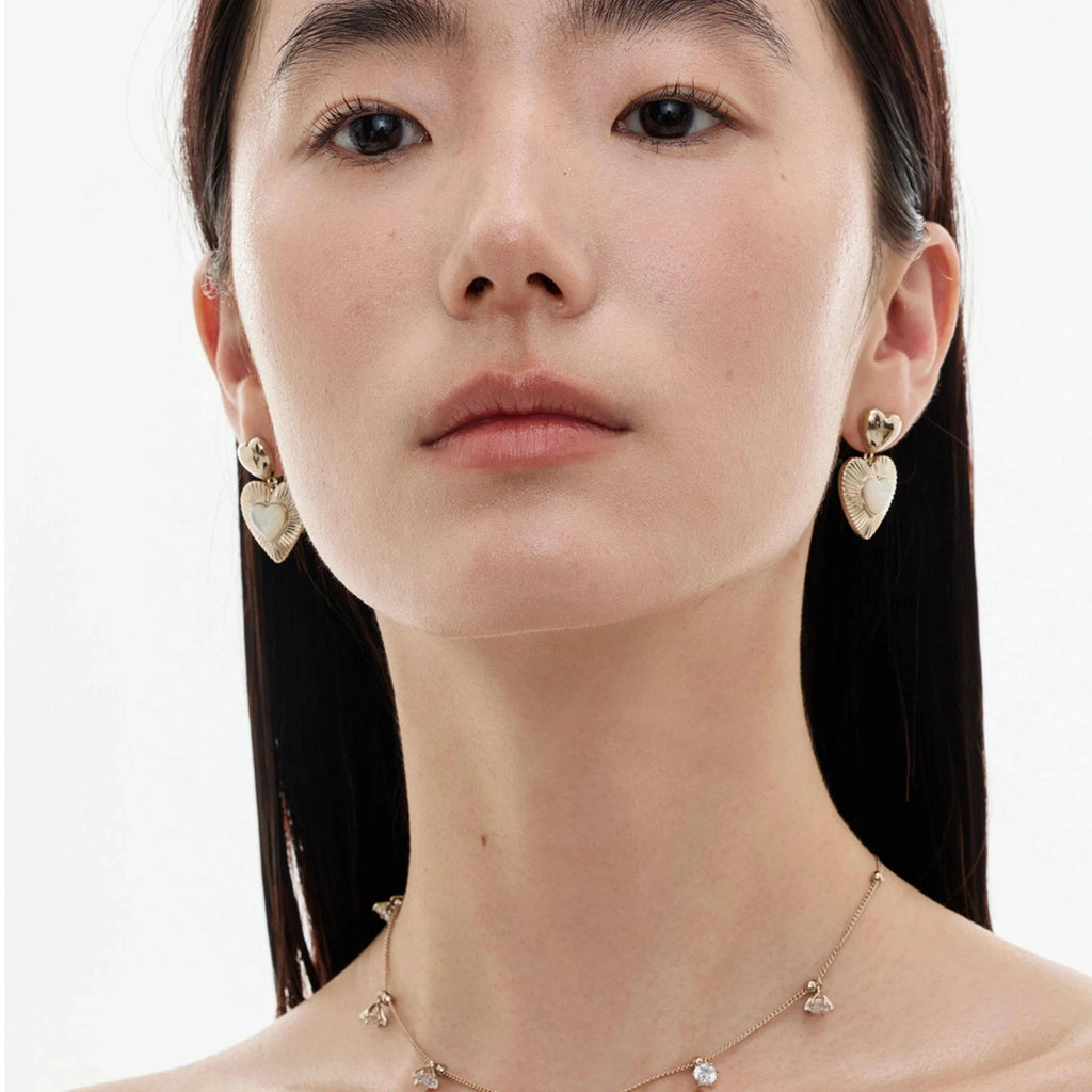 Double-Heart Pearl Drop Earrings — alternate model portrait showing design and scale