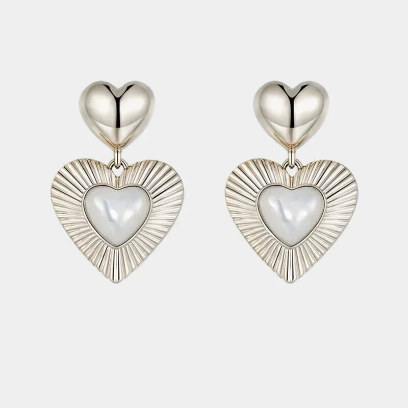 Double-Heart Pearl Drop Earrings — isolated front pair with small polished heart tops and larger ridged