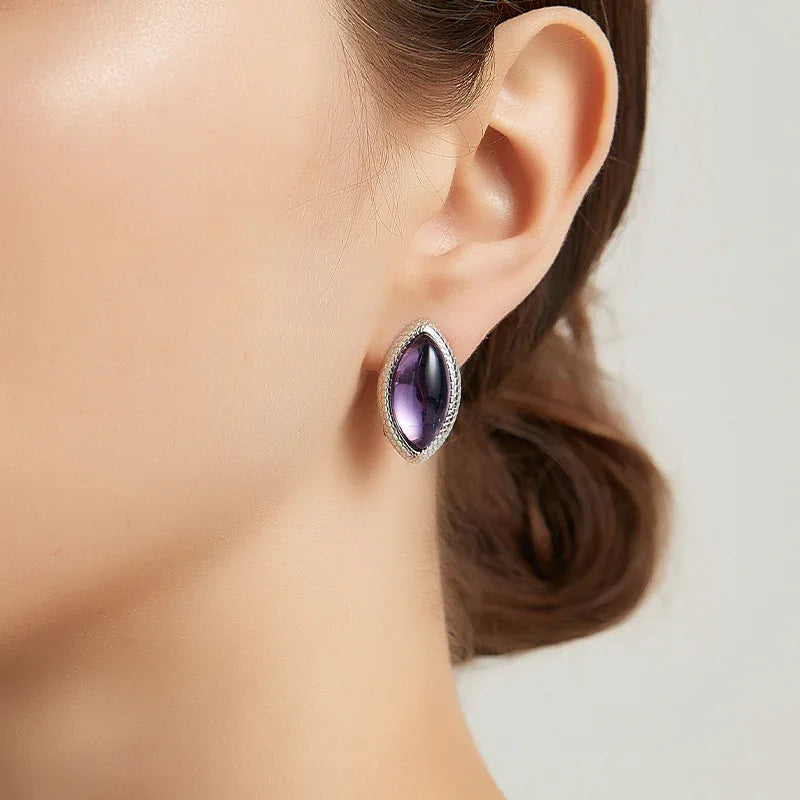 marquise amethyst stud earrings worn on the ear from a second angle