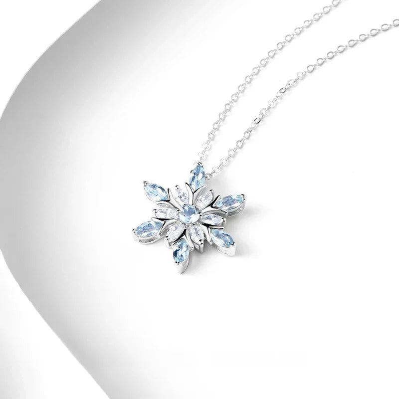 Marquise Aquamarine Snowflake Pendant Necklace angled pendant detail on white