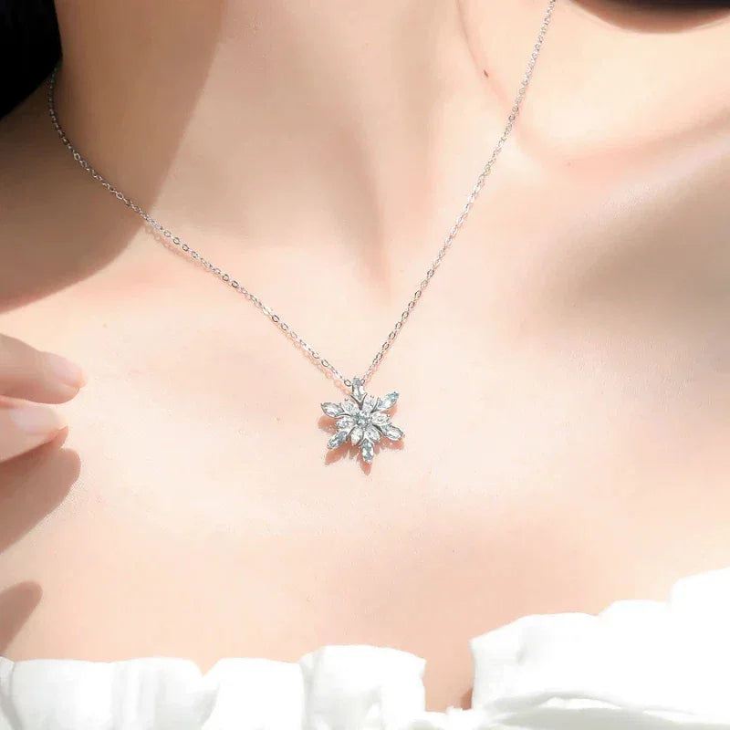 Marquise Aquamarine Snowflake Pendant Necklace worn at the neckline in a close-up