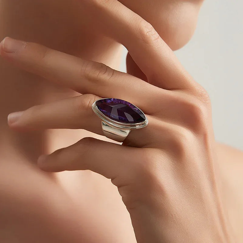 marquise amethyst sculptural ring worn detail beside the face