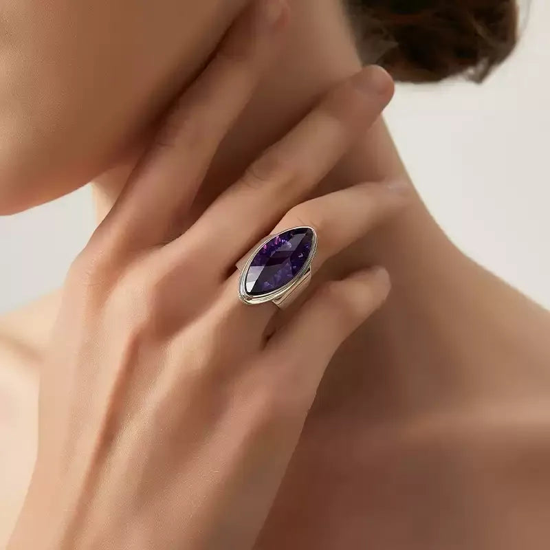 marquise amethyst sculptural ring worn on the hand in a close-up