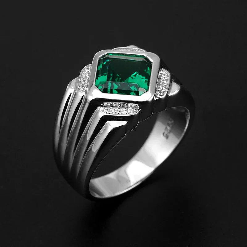 Men's 12 x 13.5 mm Emerald Ring angled product view on a dark background