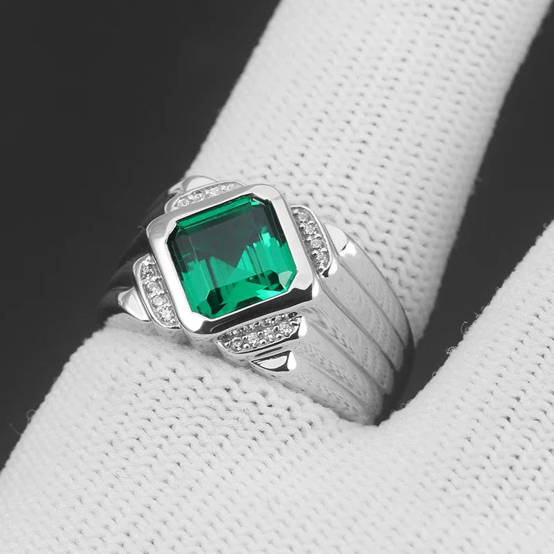 Men's 12 x 13.5 mm Emerald Ring worn on the hand in a close-up
