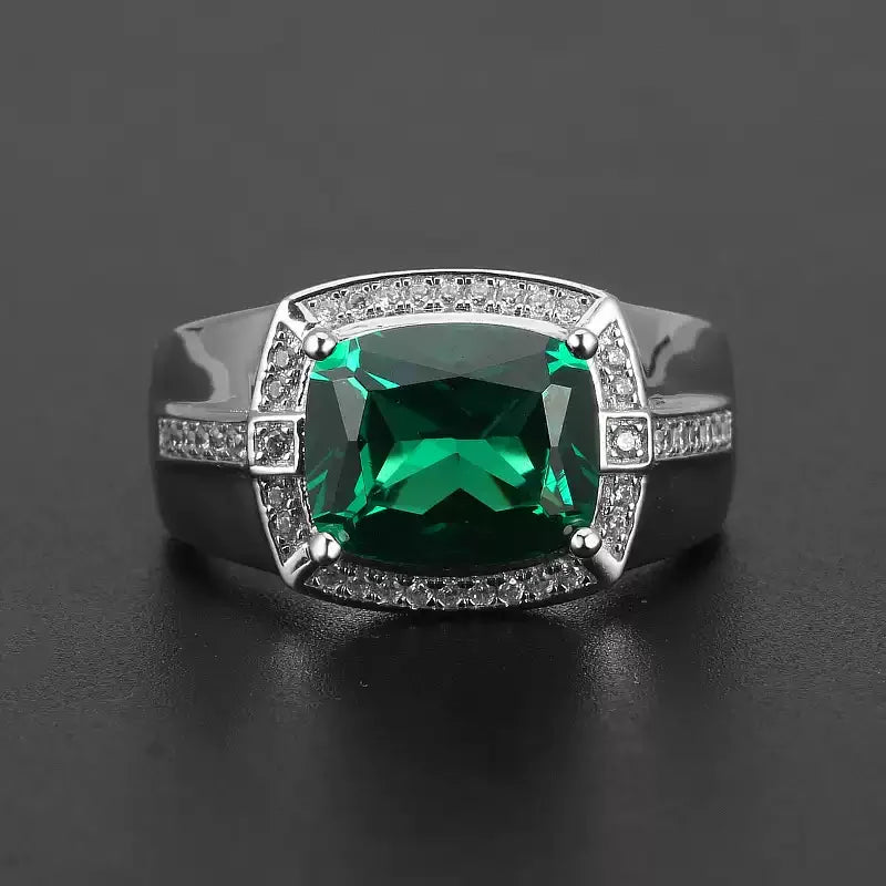 Men's 9 x 11 mm Rectangular Emerald Halo Ring angled product view on a dark background