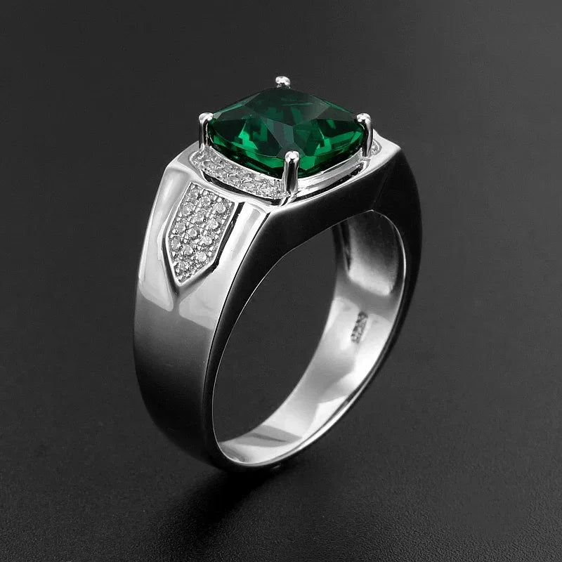Men's Cushion-Cut Emerald Ring angled product view on a dark background