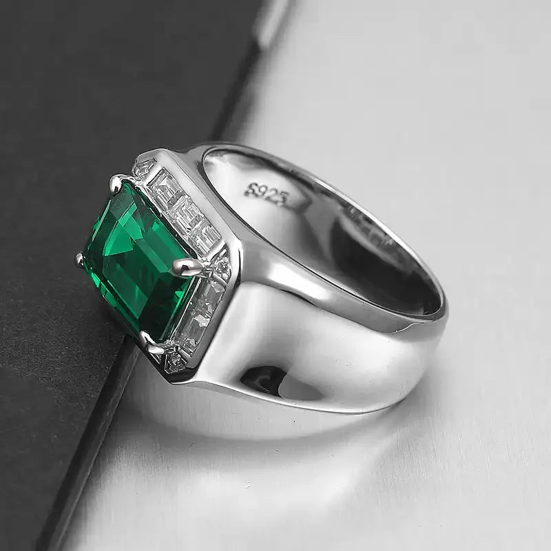 Men's Elongated Emerald Halo Ring worn on the hand in a close-up