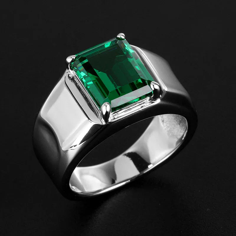 Men's Emerald Minimalist Signet Ring angled product view on a dark background
