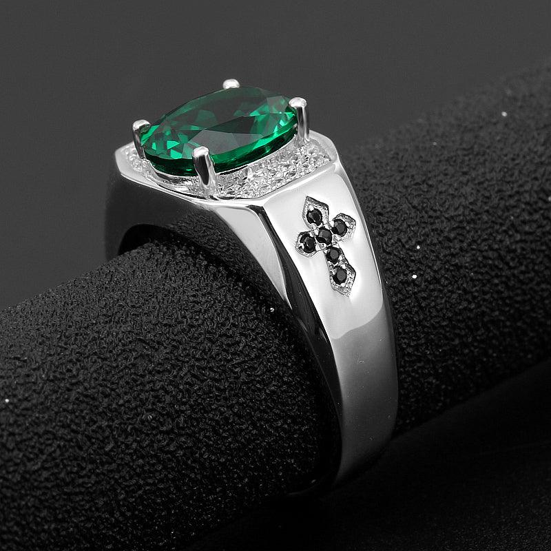 Men's Oval Emerald Fleur-de-Lis Ring side profile showing the band and setting