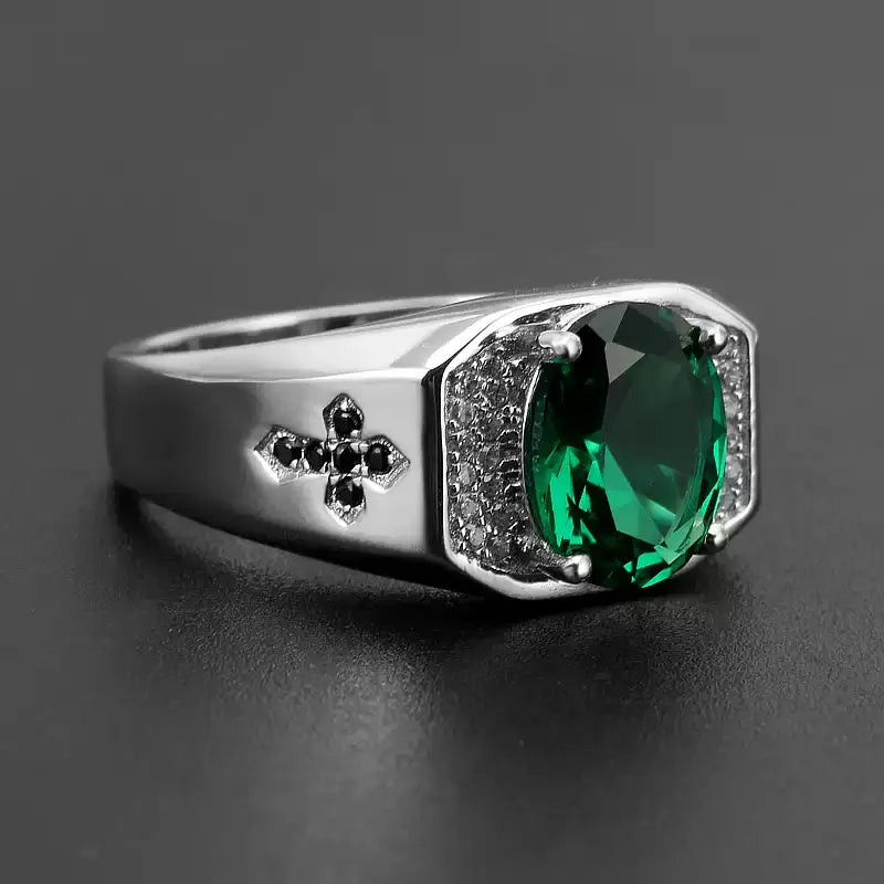 Men's Oval Emerald Fleur-de-Lis Ring worn on the hand in a close-up