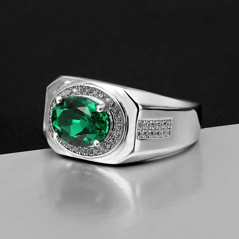 Men's Oval Emerald Halo Ring worn on the hand from a second angle