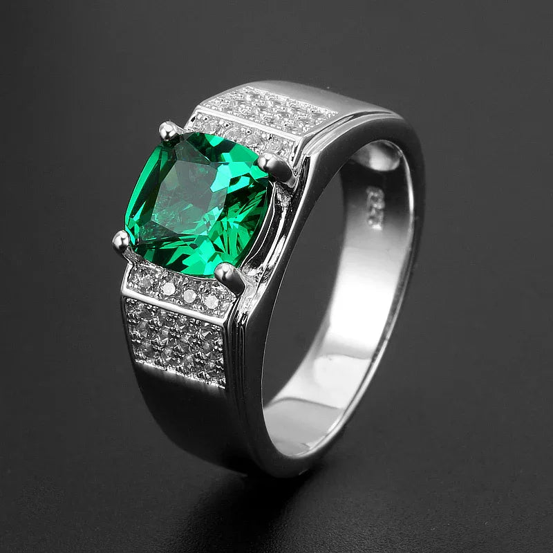 Men's Oval Emerald Pave Ring angled product view on a dark background