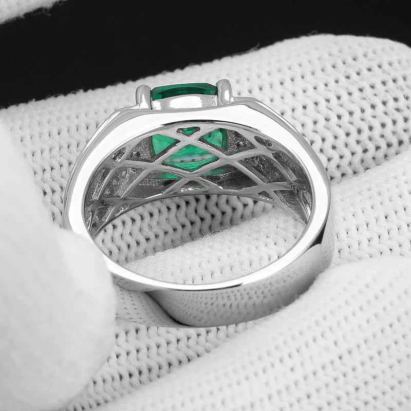Men's Oval Emerald Pave Ring worn on the hand in a close-up