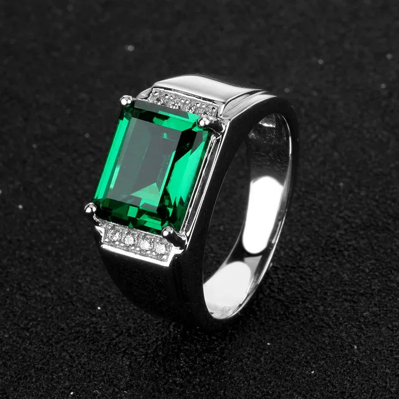 Men's Rectangular Emerald Accent Ring angled product view on a dark background