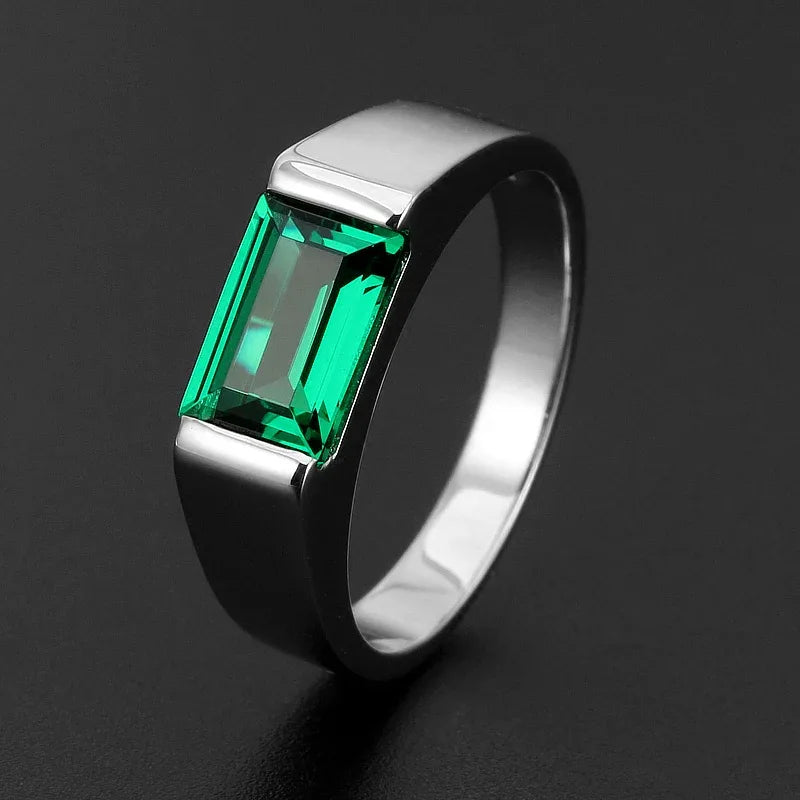 Men's Rectangular Emerald Bezel Ring angled product view on a dark background
