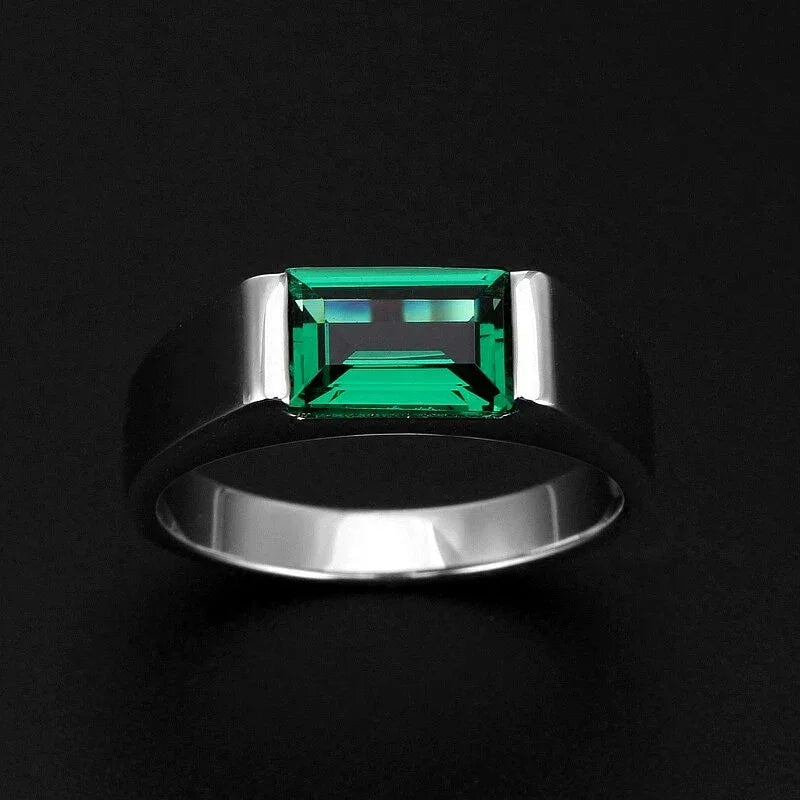 Men's Rectangular Emerald Bezel Ring worn on the hand in a close-up