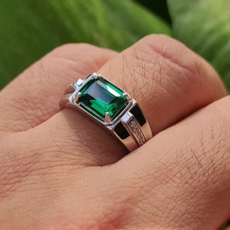 Men's Rectangular Emerald Channel Ring angled product view on a dark background