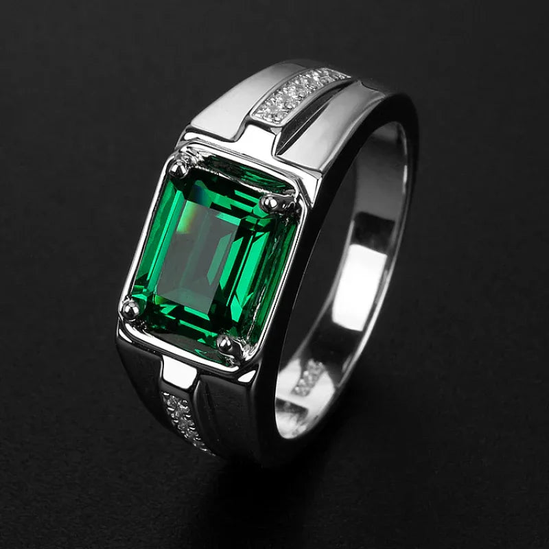 Men's Rectangular Emerald Channel Ring worn on the hand in a close-up