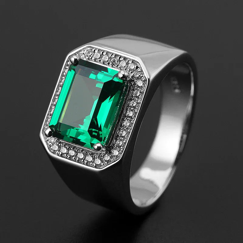 Men's Rectangular Emerald Framed Ring angled product view on a dark background