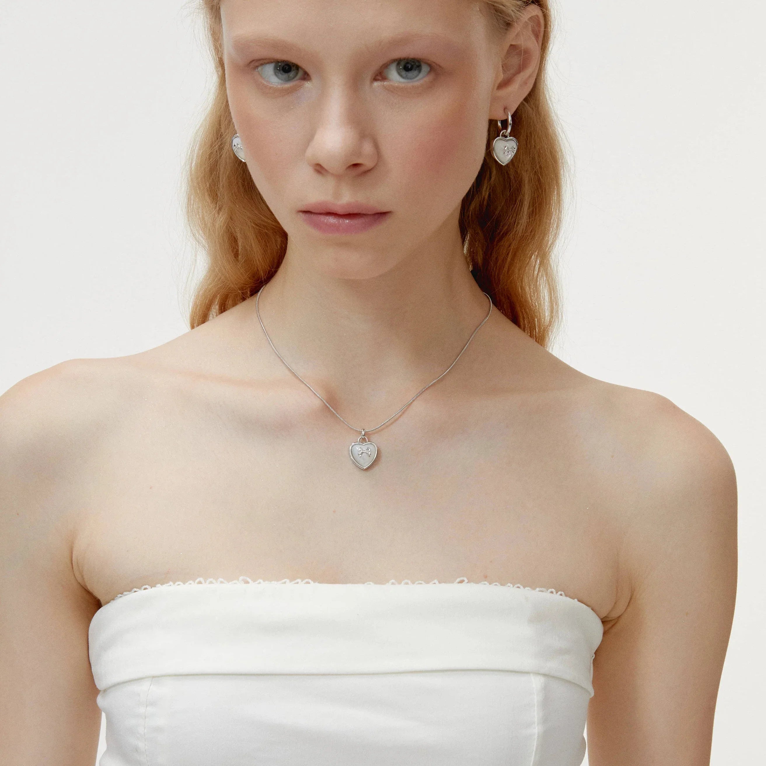 Pearl Heart Pendant Necklace with Bow Detail — alternate front model portrait