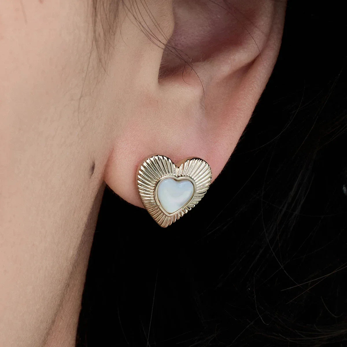 Petite Ridged Pearl Heart Stud Earrings — right-ear worn close-up showing the compact heart scale