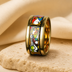 Wide gold-tone ceramic ring with a multicolor abstract portrait enamel panel on beige stone
