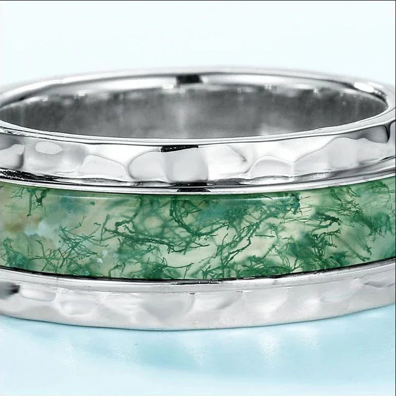 Wide-Band Moss Agate Inlay Ring — close-up of the moss-pattern inlay and recessed side accents