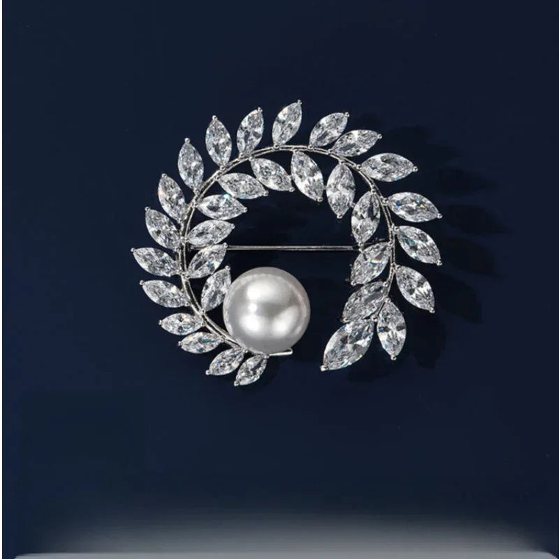 Pearl Olive Wreath Brooch — front product view on a dark background